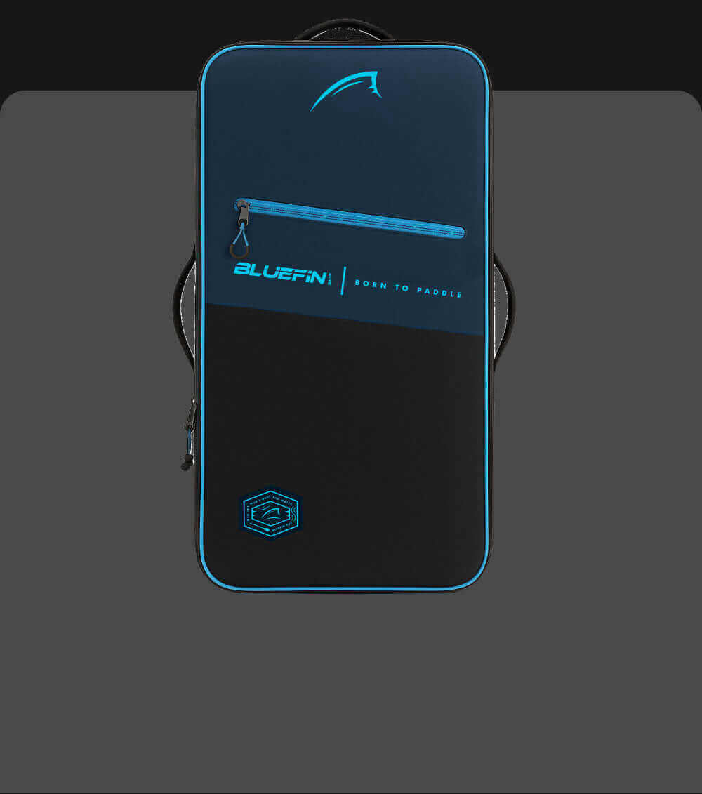 Bluefin paddleboard bag in navy and black with a front zipper and logo, designed for carrying gear.