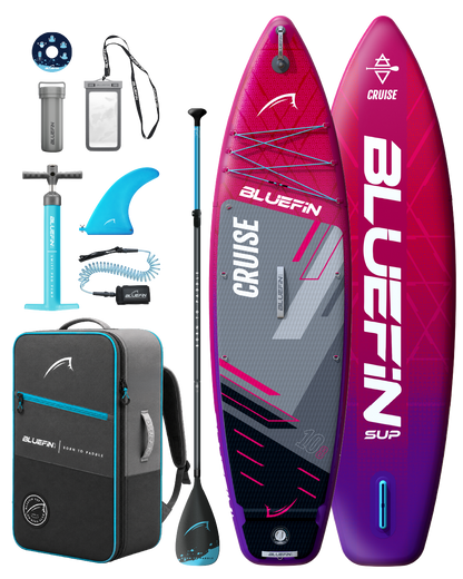 Inflatable paddleboard kit with pump, paddle, fin, backpack, and accessories in pink and blue colors.