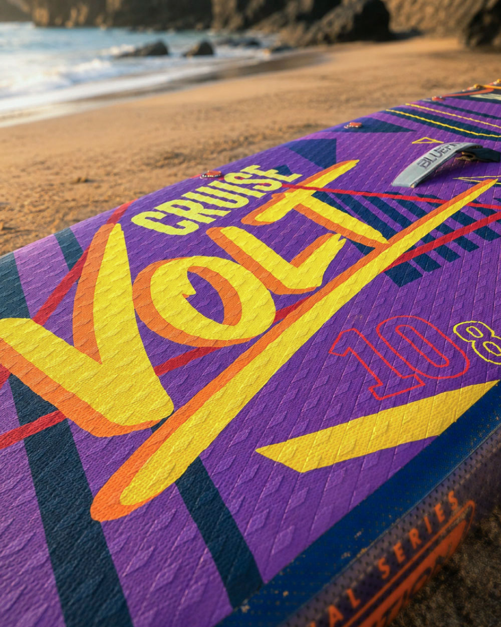 Inflatable paddleboard with vibrant purple design, featuring the words 'Cruise Volt 10.8' on the deck.